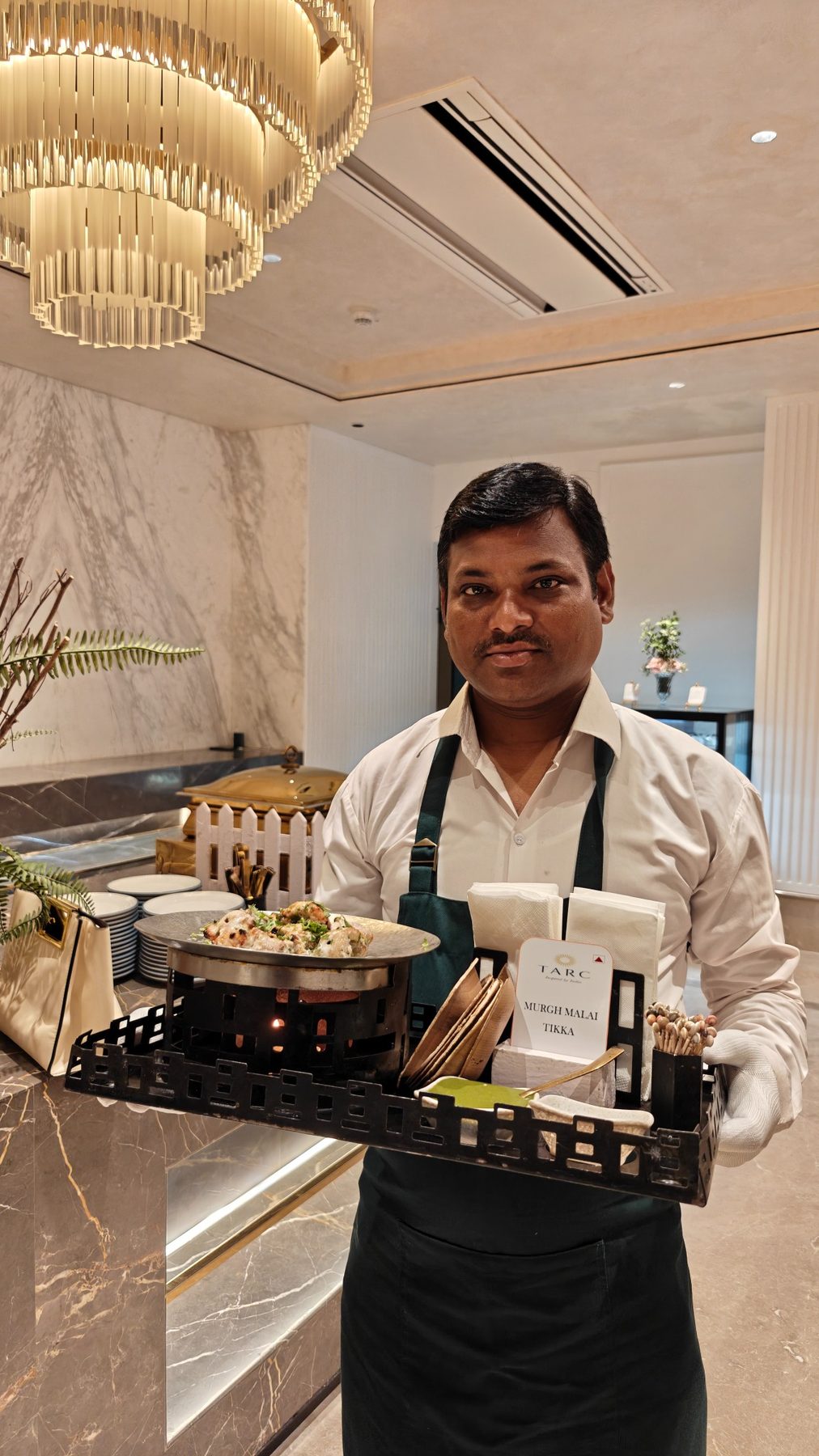 RARA culinary team member presenting food