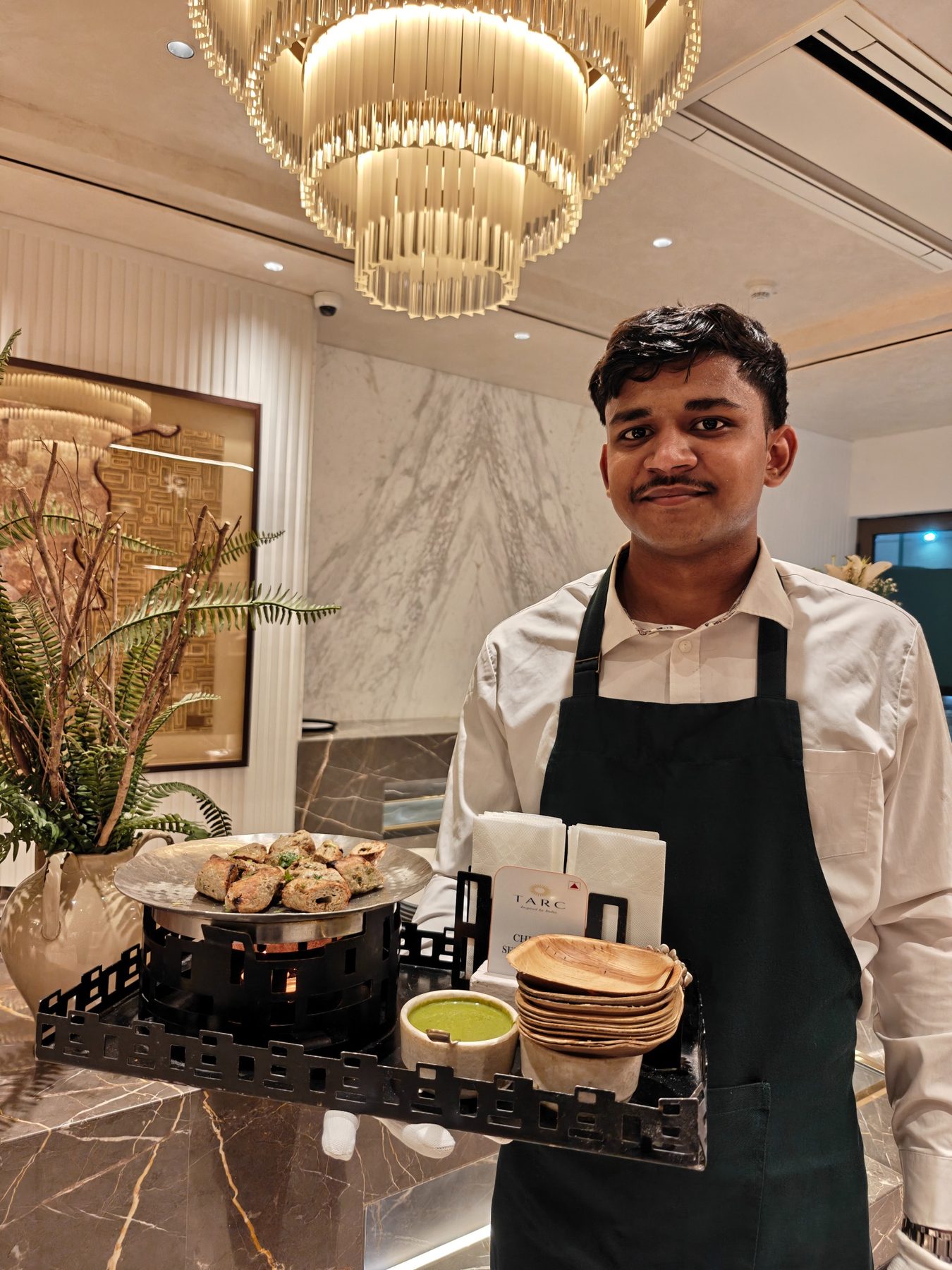 RARA team member with a live food presentation