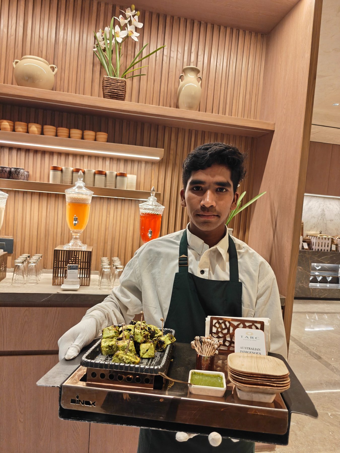 RARA team member presenting a live food station