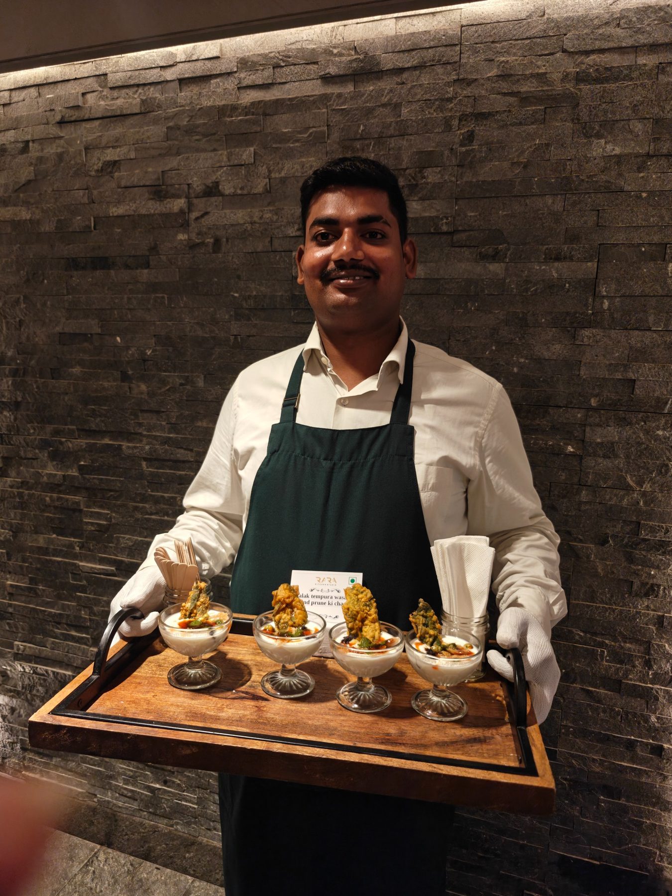 RARA team member presenting a dish